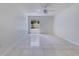 Bedroom with tile flooring, ceiling fan and window view to the backyard, offering great light at 514 Richmond Ave, Deltona, FL 32725