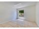 Well lit bedroom featuring tile flooring and a window view to the backyard at 514 Richmond Ave, Deltona, FL 32725