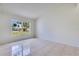 A cozy room featuring tiled flooring and a large window for natural light at 514 Richmond Ave, Deltona, FL 32725