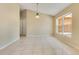 Dining area featuring a chandelier, neutral walls, and tile flooring, great for Gathering meals at 514 Richmond Ave, Deltona, FL 32725