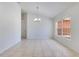 Elegant dining room featuring tiled floors and modern chandelier at 514 Richmond Ave, Deltona, FL 32725