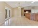 Dining area with tile flooring, natural light, and access to the screened patio at 514 Richmond Ave, Deltona, FL 32725