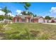 Attractive single-story home with a manicured lawn and an attached two-car garage at 514 Richmond Ave, Deltona, FL 32725
