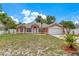 Charming single-story home featuring a well-manicured lawn and two-car garage at 514 Richmond Ave, Deltona, FL 32725