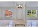 Bright foyer featuring tiled flooring, high ceilings, and natural light at 514 Richmond Ave, Deltona, FL 32725