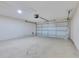 Spacious two-car garage with high ceilings, concrete floor, and automatic door opener at 514 Richmond Ave, Deltona, FL 32725