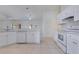 Stylish kitchen with modern white cabinets and stainless-steel appliances at 514 Richmond Ave, Deltona, FL 32725