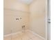 Functional laundry room features tile flooring and is equipped with utility connections at 514 Richmond Ave, Deltona, FL 32725