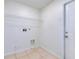 Clean and functional laundry room with tile flooring and washer and dryer hookups at 514 Richmond Ave, Deltona, FL 32725