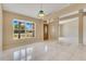 Bright living room with large windows, tile flooring, and an open layout for modern living at 514 Richmond Ave, Deltona, FL 32725