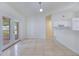 Open living room features tile flooring and seamless flow to kitchen at 514 Richmond Ave, Deltona, FL 32725