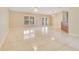 Large living space with tile floors, natural light, and view to backyard at 514 Richmond Ave, Deltona, FL 32725