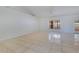 Well-lit living room with tile flooring, neutral walls, and large windows at 514 Richmond Ave, Deltona, FL 32725