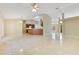 Open living space with tile flooring, ceiling fan, and lots of natural light at 514 Richmond Ave, Deltona, FL 32725