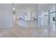 Open living room features tile flooring and seamless flow to kitchen at 514 Richmond Ave, Deltona, FL 32725