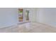 Sun-filled living room with tile floors and double door access to a screened-in patio area at 514 Richmond Ave, Deltona, FL 32725