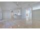 Open living room features tile flooring and seamless flow to kitchen at 514 Richmond Ave, Deltona, FL 32725