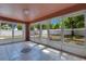Enclosed sunroom with tile flooring, numerous windows, and backyard views at 514 Richmond Ave, Deltona, FL 32725