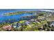 Expansive lakefront estate featuring multiple luxury homes, lush landscaping, and stunning waterfront views at 6139 Greatwater Dr, Windermere, FL 34786