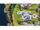 Aerial view of the home featuring a large backyard, pool, and lake access at 6139 Greatwater Dr, Windermere, FL 34786