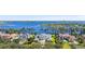 Aerial view of the home, lakefront property, and neighboring houses at 6139 Greatwater Dr, Windermere, FL 34786