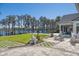 An estate backyard features a large patio with a pool and lake access at 6139 Greatwater Dr, Windermere, FL 34786