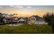 Luxury home showcases a spacious backyard with a pool, patio, and picturesque sunset views at 6139 Greatwater Dr, Windermere, FL 34786