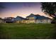 Expansive lawn, elegant white home, and a beautiful outdoor setting, perfect for entertaining and relaxation at 6139 Greatwater Dr, Windermere, FL 34786