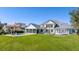 An expansive backyard with a pool, manicured lawn, and screened-in patio at 6139 Greatwater Dr, Windermere, FL 34786