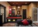 Entertainment room featuring a bar with red countertop and sphere pendant lighting at 6139 Greatwater Dr, Windermere, FL 34786