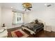 Bedroom featuring dark wood floors, an ornate bed and ceiling fan at 6139 Greatwater Dr, Windermere, FL 34786
