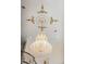 Close-up of an ornate chandelier with decorative ceiling accents and staircase at 6139 Greatwater Dr, Windermere, FL 34786