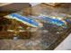 Close-up showcases a beautiful, multi-toned natural stone countertop with stunning blue accents at 6139 Greatwater Dr, Windermere, FL 34786