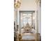 Elegant dining room featuring ornate chairs, chandelier, and large window at 6139 Greatwater Dr, Windermere, FL 34786