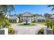 Stunning two-story home with a circular driveway, water fountain, and meticulous landscaping at 6139 Greatwater Dr, Windermere, FL 34786