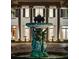 Elegant water fountain and meticulously maintained front yard of a luxury home with classic architectural design at 6139 Greatwater Dr, Windermere, FL 34786