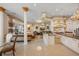 Open concept kitchen with island, chandelier, and seamless flow to living areas at 6139 Greatwater Dr, Windermere, FL 34786
