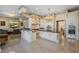 Spacious kitchen featuring two islands, chandeliers, white cabinetry, and modern appliances at 6139 Greatwater Dr, Windermere, FL 34786
