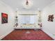 Living room with elegant decor, shelving, and a decorative chandelier at 6139 Greatwater Dr, Windermere, FL 34786