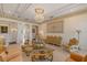 Opulent living room showcasing a chandelier, decorative ceiling, and classic furnishings at 6139 Greatwater Dr, Windermere, FL 34786