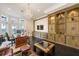 Large home office with water views, custom built-ins and a decorative chandelier at 6139 Greatwater Dr, Windermere, FL 34786