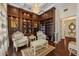 Charming study with custom built-ins, decorative ceiling, and elegant seating area at 6139 Greatwater Dr, Windermere, FL 34786