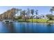 Picturesque lakefront property with a private dock, lush greenery, and stunning residence at 6139 Greatwater Dr, Windermere, FL 34786