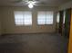 Bright, carpeted bedroom with ample natural light and mirrored closet doors at 672 Post Oak Cir # 106, Altamonte Springs, FL 32701