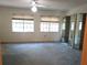 Bright bedroom features large windows, neutral walls and carpet, and mirrored closet doors at 672 Post Oak Cir # 106, Altamonte Springs, FL 32701