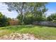 Lush backyard with mature trees and green grass, offering a private and serene outdoor retreat at 891 N Wayman St, Longwood, FL 32750