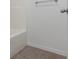 A clean and simple white tiled bathtub with silver fixtures at 891 N Wayman St, Longwood, FL 32750