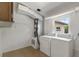 Well-lit laundry room with standard washer, dryer, and HVAC system for efficient home maintenance at 891 N Wayman St, Longwood, FL 32750