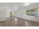 Open living room and kitchen area with tile flooring, neutral walls, and bright natural light at 891 N Wayman St, Longwood, FL 32750