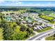 An aerial view of the community surrounded by lush greenery and multiple ponds, accessible from the main roads at 917 Royal Oak Blvd, Leesburg, FL 34748
